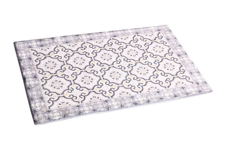 Patterned absorbent floor mat